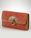 Designed in true vintage style with a softly structured silhouette, this Lauren by Ralph Lauren woven-straw clutch is outlined in rich leather to create a must-have summer accessory.