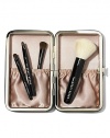 For flawless makeup application wherever you go, we kitted our travel brush set with 4 tools of the trade (in totable sizes). Inspired by Bobbi's Caviar & Oyster Collection, this limited edition set feels chic yet edgy in a sleek leather-like case. No need to wrap, this set comes in a Bobbi Brown gift box covered in a pretty pearl print. Set includes: Mini Face Blender Brush; Mini Eye Shadow/ Ultra Fine Eyeliner Brush; New Mini Smokey Eye Liner Brush; Mini Lip Brush with cap. Made in USA. 