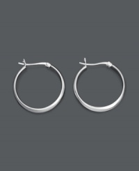 Like the little black dress of jewelry, you can never go wrong with a sophisticated pair of hoops. These large hoop earrings feature a smooth, round, sterling silver design. Approximate diameter: 1-1/5 inches.