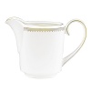 Rings of gold adorn fine white bone china with the lustrous shine of a wedding band. White bone china features two different border trims of gold, a wide corded border of textured grosgrain ribbon on some pieces, a narrow edge on others.