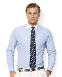 An end-on-end woven cotton poplin shirt is tailored in a trim, modern fit for timeless style. An end-on-end woven cotton poplin shirt is tailored in a trim, modern fit for timeless style.