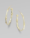 A bamboo hoop in 18K yellow gold for a subtle twist to classic design.18K gold Diameter, about 1 Post backs Made in USA 