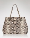 This kate spade new york tote blends practical allure with on-trend panache, crafted in snake embossed leather with carry-it-all proportions.