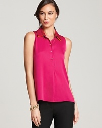 A careerist essentials gets a dose of contemporary edge as a color blocked collar freshens a classic Elie Tahari blouse. A careerist essentials gets a dose of contemporary edge as a color blocked collar freshens a classic Elie Tahari blouse.