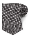 This handsome silk tie from Salvatore Ferragamo, cut in a classic silhouette for traditional appeal, helps you transition from the office into your evening affairs.