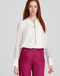 Menswear inspired, this sleek and chic tuxedo shirt features flat pleats and sheer sleeves to create a haute counterpoint with or without a blazer. Menswear inspired, this sleek and chic tuxedo shirt features flat pleats and sheer sleeves to create a haute counterpoint with or without a blazer.