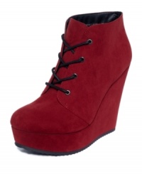 For the drama queen in all of us. Grab their attention with G by GUESS' Aleeha lace-up platform wedge shooties. For the drama queen in all of us. Grab their attention with G by GUESS' Aleeha lace-up platform wedge shooties.