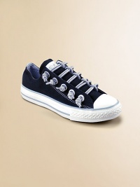 Sparkly bungee laces top this stretchy, slip-on design in cotton canvas. Slip-on styleCotton canvas upperRubber soleTraditional Chuck insoleImported Sparkly bungee laces top this stretchy, slip-on design in cotton canvas. Slip-on styleCotton canvas upperRubber soleTraditional Chuck insoleImported