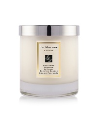 A youthful and fruity fragrance, inspired by the delicious scent of just-ripening nectarines and a taste of refreshing peach sorbet. Mouthwatering nectarine and peach with hints of plum, blackcurrant and vetiver are combined with the sweet warmth of acacia honey in this truly seductive combination. The Nectarine Blossom & Honey Home Candle infuses any room with evocative scent and lasts for hours. An everyday luxury, it brings warmth to any environment. 200g. A youthful and fruity fragrance, inspired by the delicious scent of just-ripening nectarines and a taste of refreshing peach sorbet. Mouthwatering nectarine and peach with hints of plum, blackcurrant and vetiver are combined with the sweet warmth of acacia honey in this truly seductive combination. The Nectarine Blossom & Honey Home Candle infuses any room with evocative scent and lasts for hours. An everyday luxury, it brings warmth to any environment. 200g.