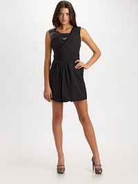 An asymmetrical silhouette with front draping that ends in a bubble hem.Sleeveless Pleated waist detail Hidden side zipper About 31½ from shoulder to hem Fully lined Silk; dry clean Yoke, 95% silk/5% spandex Imported An asymmetrical silhouette with front draping that ends in a bubble hem.Sleeveless Pleated waist detail Hidden side zipper About 31½ from shoulder to hem Fully lined Silk; dry clean Yoke, 95% silk/5% spandex Imported