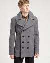 A traditional double-breasted silhouette completes the winter warmth of this handsome overcoat, shaped in a supremely-soft wool blend for a fit and feel that is timeless.Button-frontSide slash pocketsAbout 31 from shoulder to hem90% wool/10% nylonDry cleanImportedThis style runs true to size. We recommend ordering your usual size for a standard fit. 