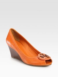 Pebbled leather silhouette with a stacked wedge, peep toe and designer emblem. Stacked wedge, 2½ (65mm)Leather upperLeather liningRubber solePadded insoleImportedOUR FIT MODEL RECOMMENDS ordering true size. Pebbled leather silhouette with a stacked wedge, peep toe and designer emblem. Stacked wedge, 2½ (65mm)Leather upperLeather liningRubber solePadded insoleImportedOUR FIT MODEL RECOMMENDS ordering true size.