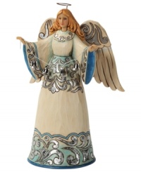 Full of great joy, this angel welcomes the Christmas spirit into your home. While striking blue and silver hues dance across her robe & wings, her calm expression & peaceful countenance create an undeniable warmth. Full of great joy, this angel welcomes the Christmas spirit into your home. While striking blue and silver hues dance across her robe & wings, her calm expression & peaceful countenance create an undeniable warmth.