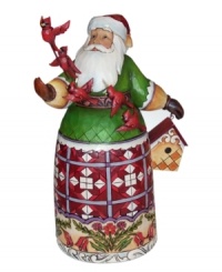 With a cardinal on his staff and carved in his skirt, this meticulously handcrafted Santa Claus collectible from Jim Shore extends Christmas spirit to all creatures, large and small. With a cardinal on his staff and carved in his skirt, this meticulously handcrafted Santa Claus collectible from Jim Shore extends Christmas spirit to all creatures, large and small.