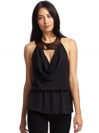 THE LOOKBeaded circle halter neckline with a floral detailPullover styleSleevelessDraped bodice with keyhole detailElastic drop waistLow backMetal logo at hemTHE FITDraped silhouetteAbout 30 from shoulder to longest point of hemTHE MATERIALSilkCARE & ORIGINDry cleanMade in USA THE LOOKBeaded circle halter neckline with a floral detailPullover styleSleevelessDraped bodice with keyhole detailElastic drop waistLow backMetal logo at hemTHE FITDraped silhouetteAbout 30 from shoulder to longest point of hemTHE MATERIALSilkCARE & ORIGINDry cleanMade in USA