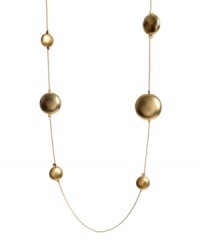 Add a long layer of rich, golden bubbles to your neckline in this light and airy necklace. Crafted in worn gold tone mixed metal; by Kenneth Cole New York. Approximate length: 36 inches.