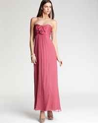 A collection of silk rosettes at the bodice lends romantic appeal to this empire waist gown from Amsale. A collection of silk rosettes at the bodice lends romantic appeal to this empire waist gown from Amsale.