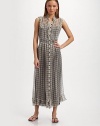Airy silk chiffon in graphic window checks, is trimmed with ruffles for an ultra femme design.Ruffled collar Sleeveless with ruffle trim Ruffled front button placket Seamed waist Ruffled hem Contrast rayon camisole dress About 50 from shoulder to hem Silk; dry clean Made in Italy