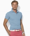 A trim-fitting short-sleeved polo shirt is rendered in breathable cotton mesh for superior comfort and style.