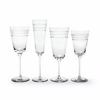 Kate Spade and Lenox join together to bring ease, elegance and understated wit to the table. Library Stripe Stemware features frosted stripes on tall, elegant stems. Shown from left to right: goblet, flute, iced beverage, wine glass. Coordinates perfectly with the Library Stripe Dinnerware. Kate Spade and Lenox join together to bring ease, elegance and understated wit to the table. Library Stripe Stemware features frosted stripes on tall, elegant stems. Shown from left to right: goblet, flute, iced beverage, wine glass. Coordinates perfectly with the Library Stripe Dinnerware.