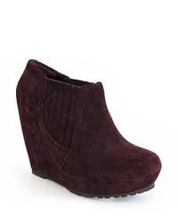 These Luxury Rebel wedge platform booties keep things subtly interesting with texture, featuring Western-style gored side panels. These Luxury Rebel wedge platform booties keep things subtly interesting with texture, featuring Western-style gored side panels.