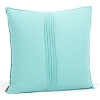 A solid linen pillow in bright turquoise with pintuck pleats in the center and a pinched hem. Coordinates with the Mataveri collection.