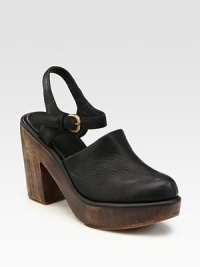 Classic leather clog with an earthy wooden heel and platform, modernized by a slingback, rubber sole and adjustable ankle strap. Wooden heel, 4 (100mm)Wooden platform, 1 (25mm)Compares to a 3 heel (75mm)Leather upperLeather liningRubber solePadded insoleImportedOUR FIT MODEL RECOMMENDS ordering true size. Classic leather clog with an earthy wooden heel and platform, modernized by a slingback, rubber sole and adjustable ankle strap. Wooden heel, 4 (100mm)Wooden platform, 1 (25mm)Compares to a 3 heel (75mm)Leather upperLeather liningRubber solePadded insoleImportedOUR FIT MODEL RECOMMENDS ordering true size.
