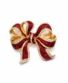 Wrap up your look! Add instant Christmas Cheer with Charter Club's vibrant ribbon pin. Crafted in gold tone mixed metal, brooch features glittery red enamel and sparkling crystal accents. Item comes packaged in a signature gift box. Approximate size: 2 inches.
