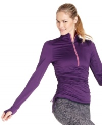 Get active in Ideology's sporty pullover. A breathable fabric blend keeps you cool and dry; ruching at the bodice and smart thumbholes at the sleeves offer a perfect fit. Get active in Ideology's sporty pullover. A breathable fabric blend keeps you cool and dry; ruching at the bodice and smart thumbholes at the sleeves offer a perfect fit.
