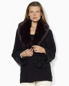 A plush detachable faux-fur collar lends luxurious style to a soft knit wrap cardigan with modern dolman sleeves.