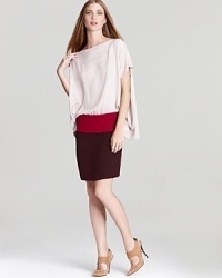 A billowing bodice tops off a fitted skirt on this This DIANE von FURSTENBERG dress, creating a chic two-in-one look that works day or night. A billowing bodice tops off a fitted skirt on this This DIANE von FURSTENBERG dress, creating a chic two-in-one look that works day or night.