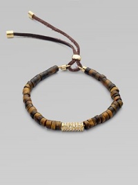 Beautifully textured tiger's eye-inspired beads accented with a center, rhinestone encrusted bead and an adjustable leather closure. Epoxy beadsGlass stonesGoldtone brassLeather cordDiameter, about 2½ stretchableLeather slide adjusterImported Beautifully textured tiger's eye-inspired beads accented with a center, rhinestone encrusted bead and an adjustable leather closure. Epoxy beadsGlass stonesGoldtone brassLeather cordDiameter, about 2½ stretchableLeather slide adjusterImported