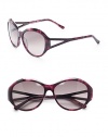 THE LOOKRounded style Variegated acetate framesAustrian crystal temple accentsCutout templesUVA and UVB protection Signature case includedTHE COLORVariegated purple with grey gradient lensesORIGINImported