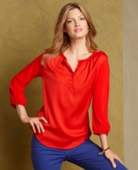 Pack a stylish punch in Tommy Hilfiger's breezy tunic, crafted in a statement-making shade that looks so on-trend with your boldest colored jeans. Pack a stylish punch in Tommy Hilfiger's breezy tunic, crafted in a statement-making shade that looks so on-trend with your boldest colored jeans.