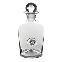 A shapely profile and regal lion's head detail make this weighty glass decanter from Juliska a handsome option for presenting favorite spirits.