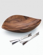 An artisan bowl is handcrafted of dense, durable acacia with a finely patterned grain and modern, sloping lines. Unique servers made of stainless steel define this beautiful serving set. 19W X 5H X 12½D Hand wash Imported