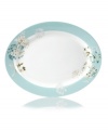 Romance blossoms at tables with the Silk Floral oval platter. Modern, fuss-free porcelain from Mikasa bears artsy garden blooms in teal and cream for a look of serene grace and femininity.