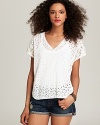 Rock a romantic weekend look in this embroidered eyelet poncho top from boho brand Johnny Was Collection.