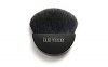 Laura Mercier Mineral Primer Brush is a black goat hair brush with half moon-shaped head and small handle for perfect application of Mineral Primer to quickly manuever the planes and contours of the face. 2.5 inches in length.