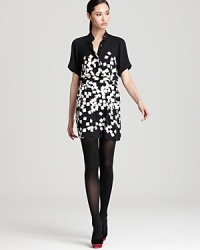 A vision in black and white, this striking DIANE von FURSTENBERG dress, features a modern cubic print and side buckles that lend a flattering cinched waist silhouette. A vision in black and white, this striking DIANE von FURSTENBERG dress, features a modern cubic print and side buckles that lend a flattering cinched waist silhouette.