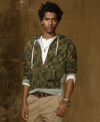 Channel an earthy yet urban vibe in a full-zip camouflage hoodie with contrast cuffs and side panels for cool style.