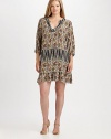 A silk dress featuring a duo of contrasting prints and a feminine-yet-comfortable fit. Its v-neckline will flawlessly complement your decolletage.V-neckThree-quarter sleevesAllover printGold button closureAbout 38 from shoulder to hemSilkDry cleanImported