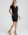 Fluid draping lends elegant dimension to this standout DKNY dress. Garnish with gold accents and step into the spotlight.
