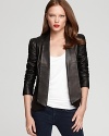 A sharp asymmetric hemline is eye-catching on this Rebecca Minkoff leather blazer, replete with puff shoulders and pleating at the elbows. A finishing touch for your cocktail silhouettes, this forward style lends modern edge to the most classic looks.