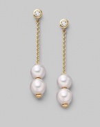 From the Pearls in Motion Collection. Delicate chains of 18k gold dangle from diamond studs and hold white Akoya pearls that slide up and down but stay where you place them. 7mm white round cultured pearls Quality: A+ Diamonds, 0.14 tcw 18k yellow gold Drop, about 1¾ Post back Imported