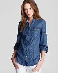 Well-worn chambray outfits an essential Burberry Brit button-down, featuring pearlescent buttons and peasant sleeves for a rustic approach to elegance. Team with skinny jeans for a denim-on-denim look that is so right now. Well-worn chambray outfits an essential Burberry Brit button-down, featuring pearlescent buttons and peasant sleeves for a rustic approach to elegance. Team with skinny jeans for a denim-on-denim look that is so right now.