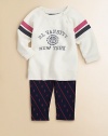 An ultra-comfortable set includes a stylish collegiate-inspired varsity fleece sweatshirt and legging, rendered in a stripe and owl print. Sweatshirt CrewneckLong raglan sleevesFront buttons Leggings Elastic waistband60% cotton/40% polyesterMachine washImported