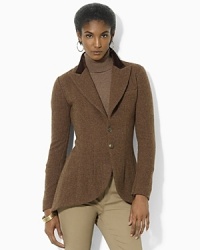 Rendered in hearty wool tweed, a chic two-button jacket is steeped in equestrian inspiration. Rendered in hearty wool tweed, a chic two-button jacket is steeped in equestrian inspiration.