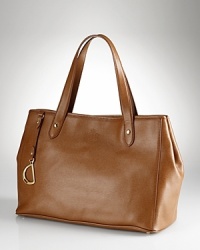 Lauren Ralph Lauren gives its tried-and-true tote an elegant update with studded details and an embossed logo. Lauren Ralph Lauren gives its tried-and-true tote an elegant update with studded details and an embossed logo.