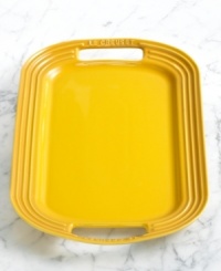 Simplify the preparation, maximize the presentation. Le Creuset's enameled stoneware serving platters go from oven to table with two easy handles for effortless transportation and a timeless appearance that stands out as a centerpiece. Built strong and durable, this collection of serving plates resists staining, chipping and cracking, making it the perfect dish for parties and entertaining. 5-year warranty. Simplify the preparation, maximize the presentation. Le Creuset's enameled stoneware serving platters go from oven to table with two easy handles for effortless transportation and a timeless appearance that stands out as a centerpiece. Built strong and durable, this collection of serving plates resists staining, chipping and cracking, making it the perfect dish for parties and entertaining. 5-year warranty.